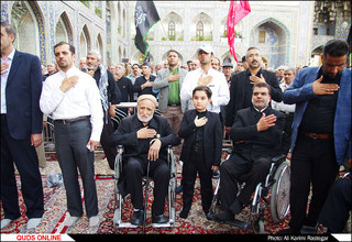 آیین تعویض پرچم گنبد منور حضرت رضا(ع)