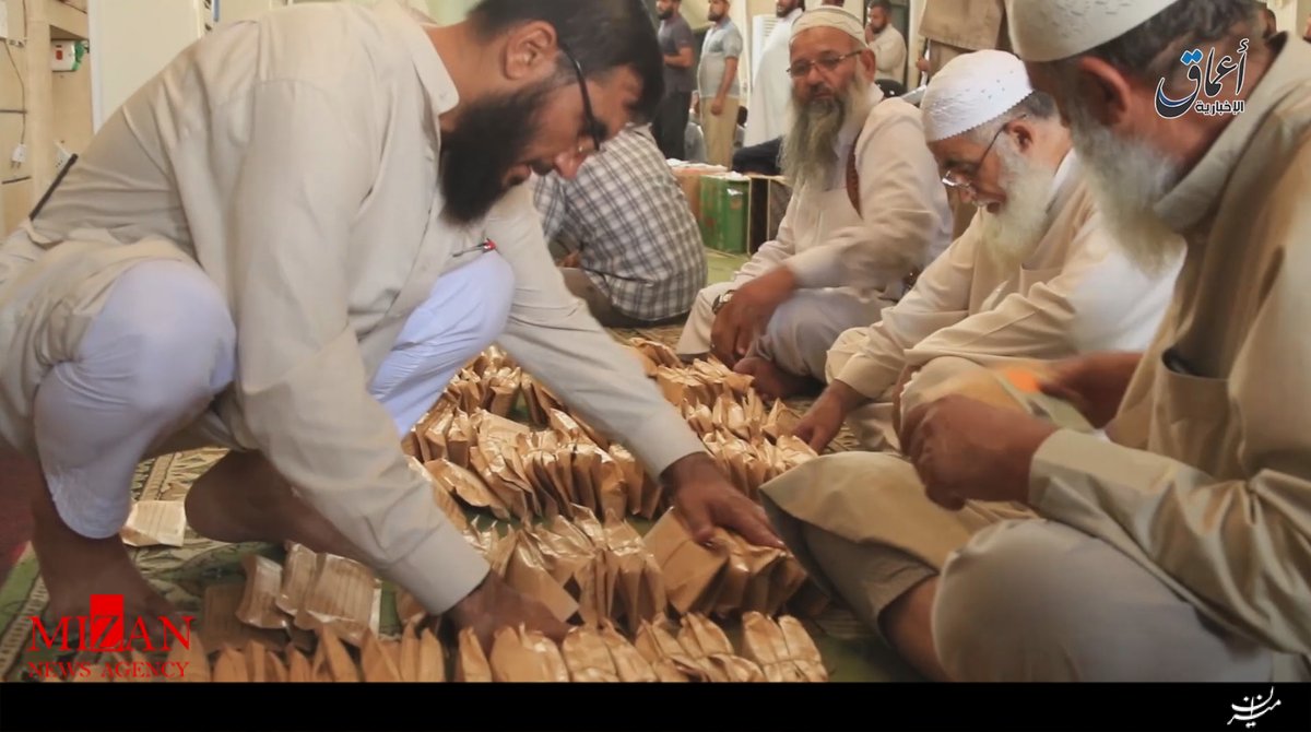 توزیع پول وغذای رایگان در موصل ادعای مضحک داعش+عکس