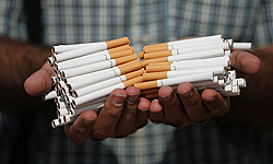 کشف ۵۵۰ هزار نخ سیگار خارجی جاسازی‌شده در محموله یونجه در مراغه