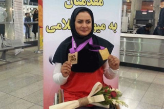 زهرا نعمتی مدال جهانی خود را به شهدای مدافع حرم و شهید حججی تقدیم کرد