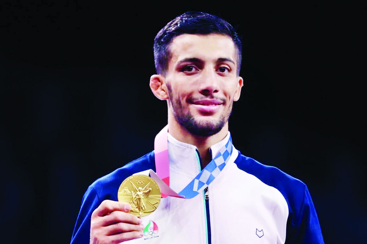 قهرمان کشتی جهان و المپیک خادم امام رضا(ع) شد